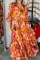 橙色抽象印花褶裥半袖纽扣超长连衣裙
