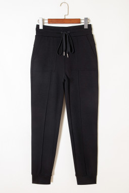 黑色裸露的接缝细节瘦牵引慢跑裤