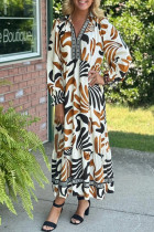 棕色热带印花撞色领口长袖荷叶边下摆连衣裙