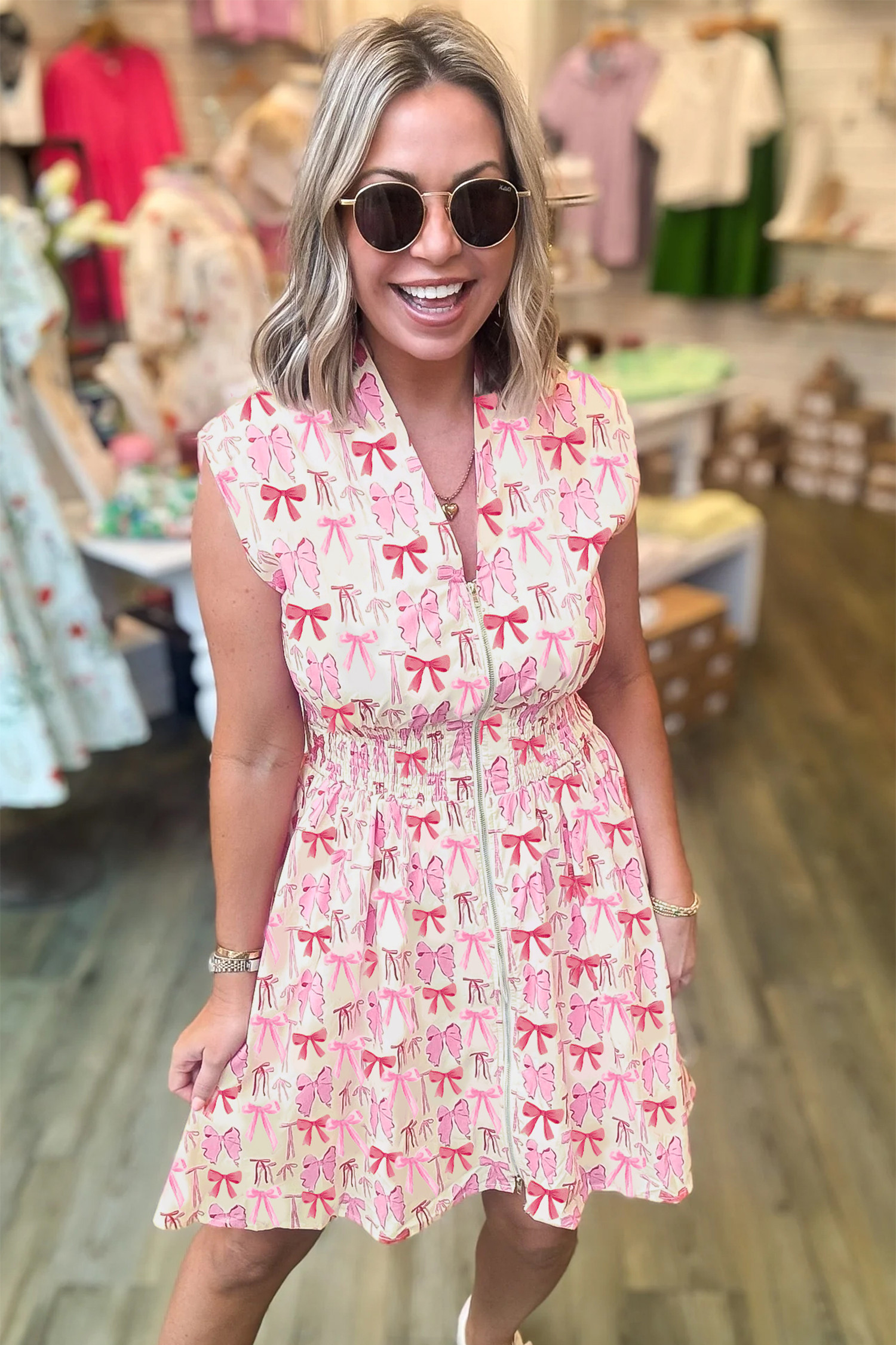 粉色全拉链收腰无袖蝴蝶结迷你连衣裙 LC6127610