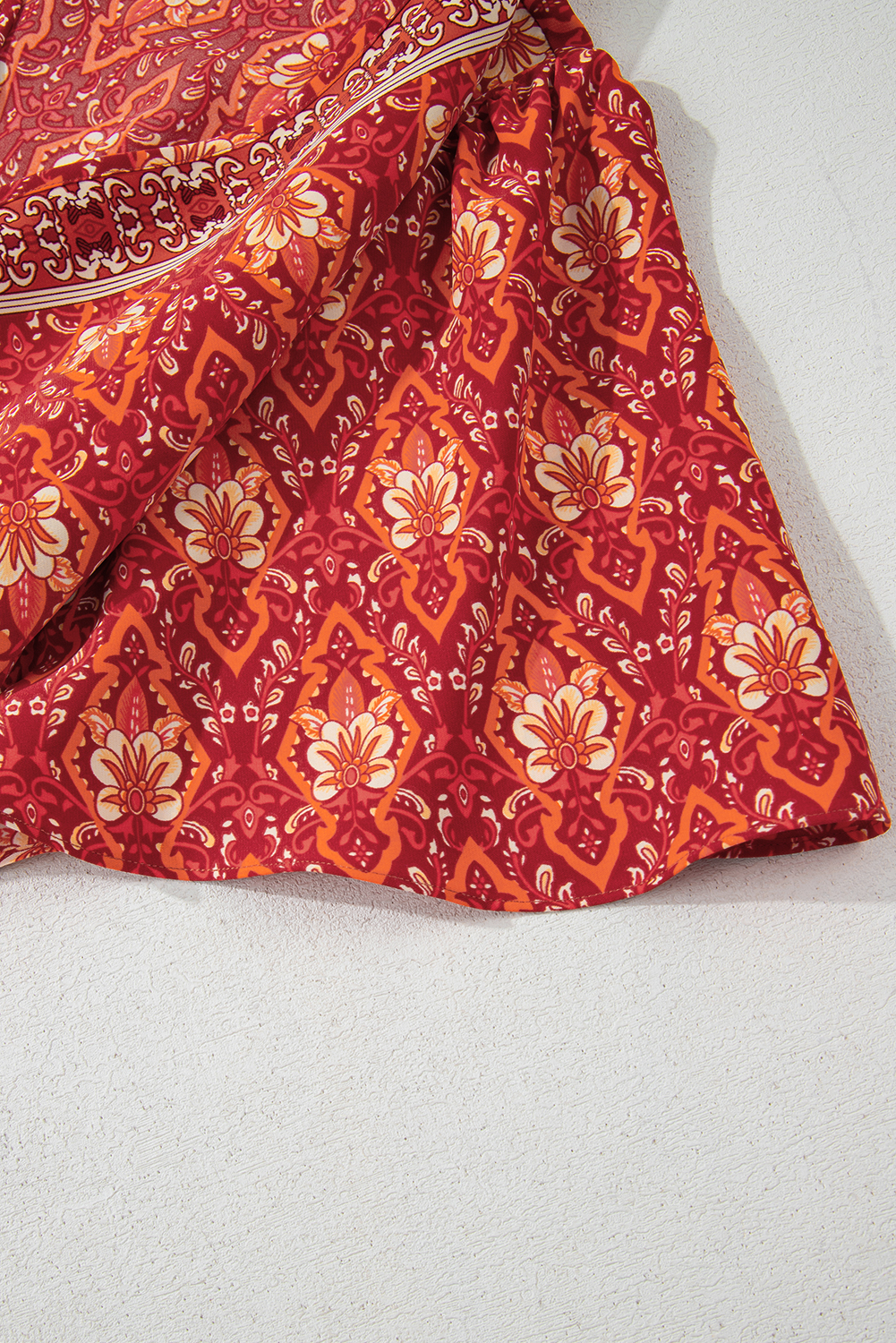 Plus Size Orange  Printed Surplice Neck Empire Waist Flowy Mini Dress