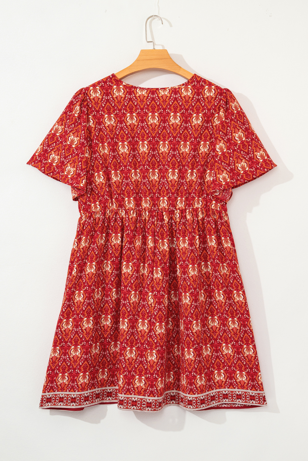 Plus Size Orange  Printed Surplice Neck Empire Waist Flowy Mini Dress