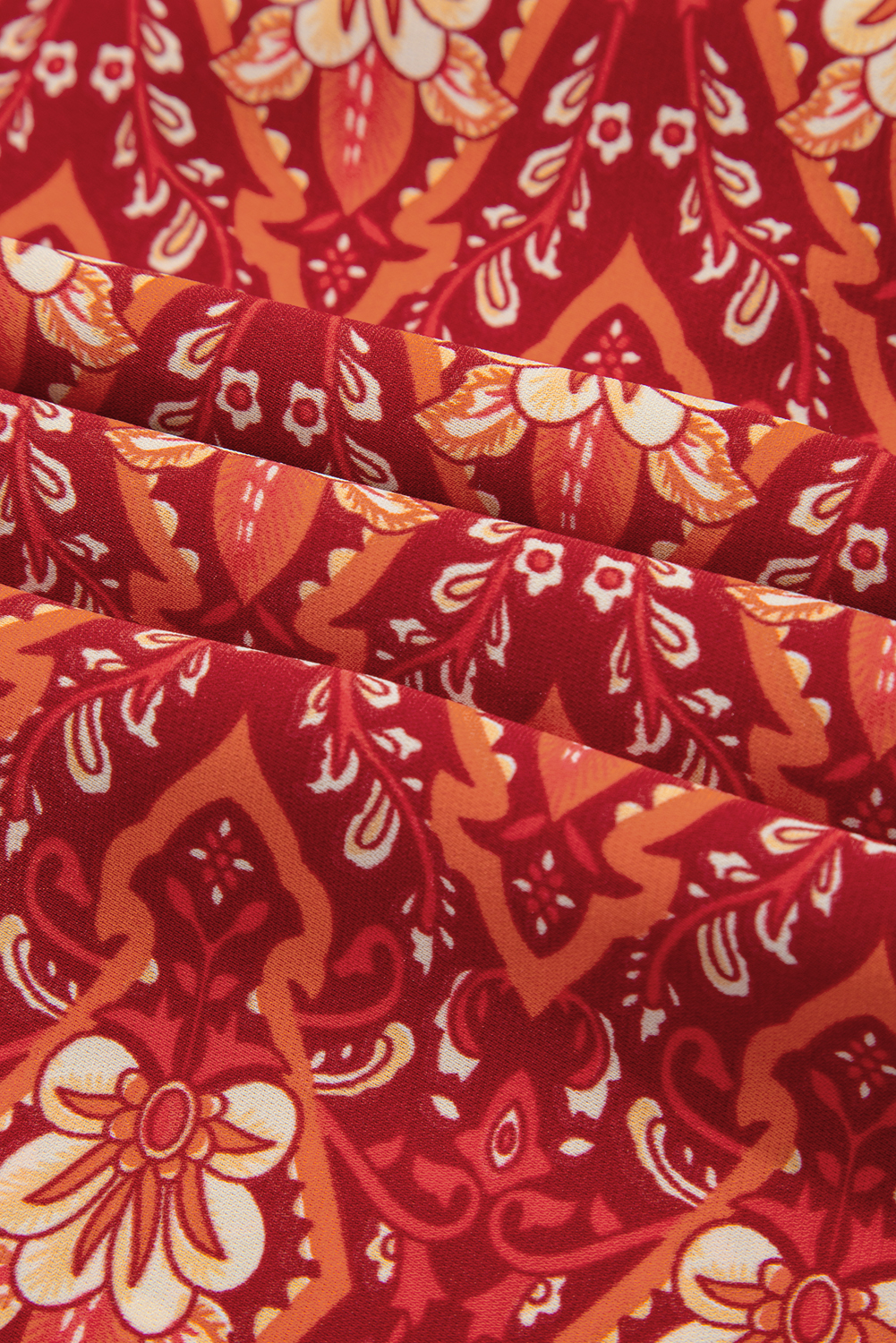 Plus Size Orange  Printed Surplice Neck Empire Waist Flowy Mini Dress