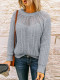 Suéter gris de punto de empalme de encaje con cuello redondo