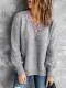 Suéter holgado con abertura lateral y escote en V festoneado de encaje gris