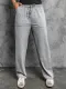 Pantalones holgados de punto con cintura con cordón y bolsillos